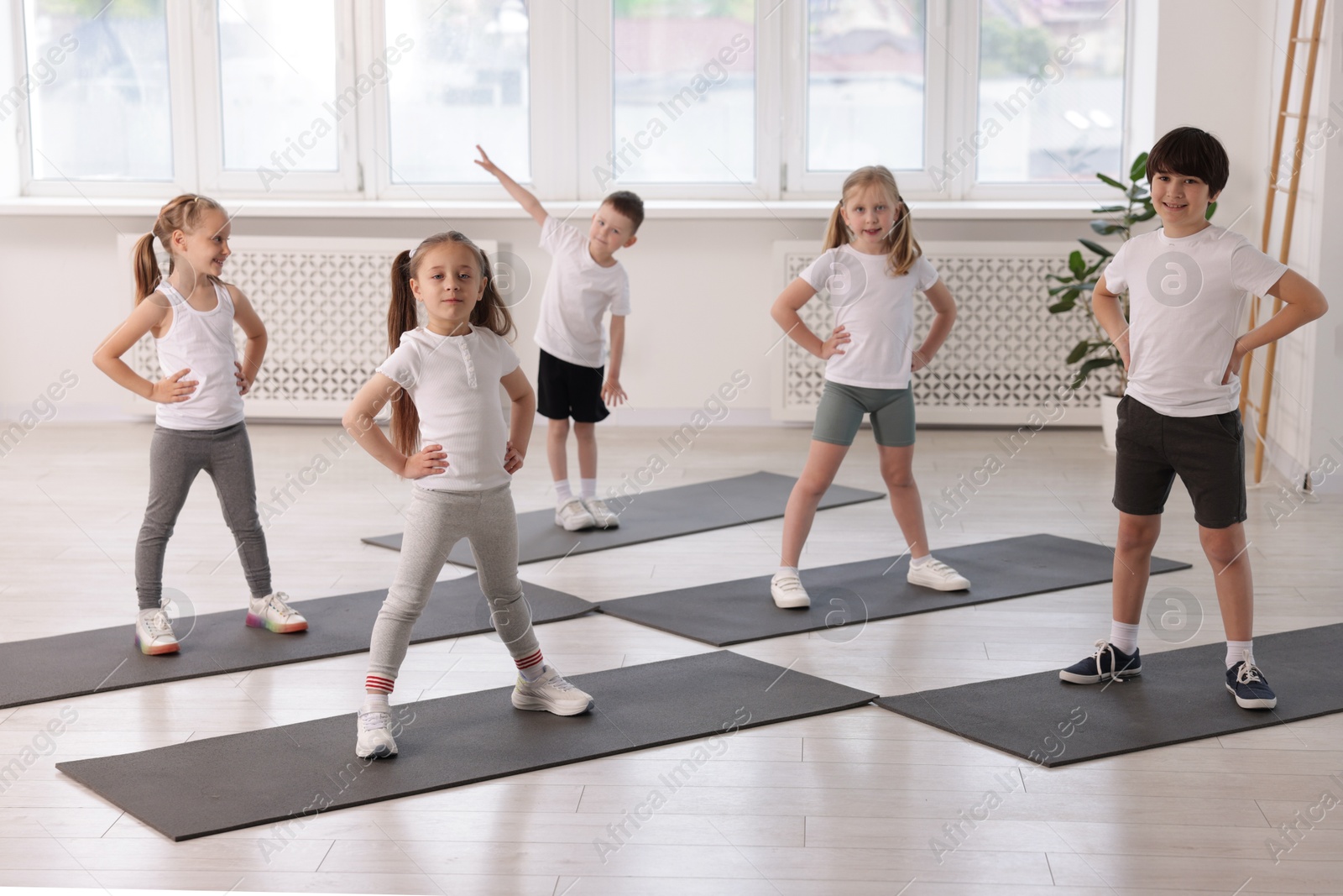 Photo of Group of children on yoga mats in class