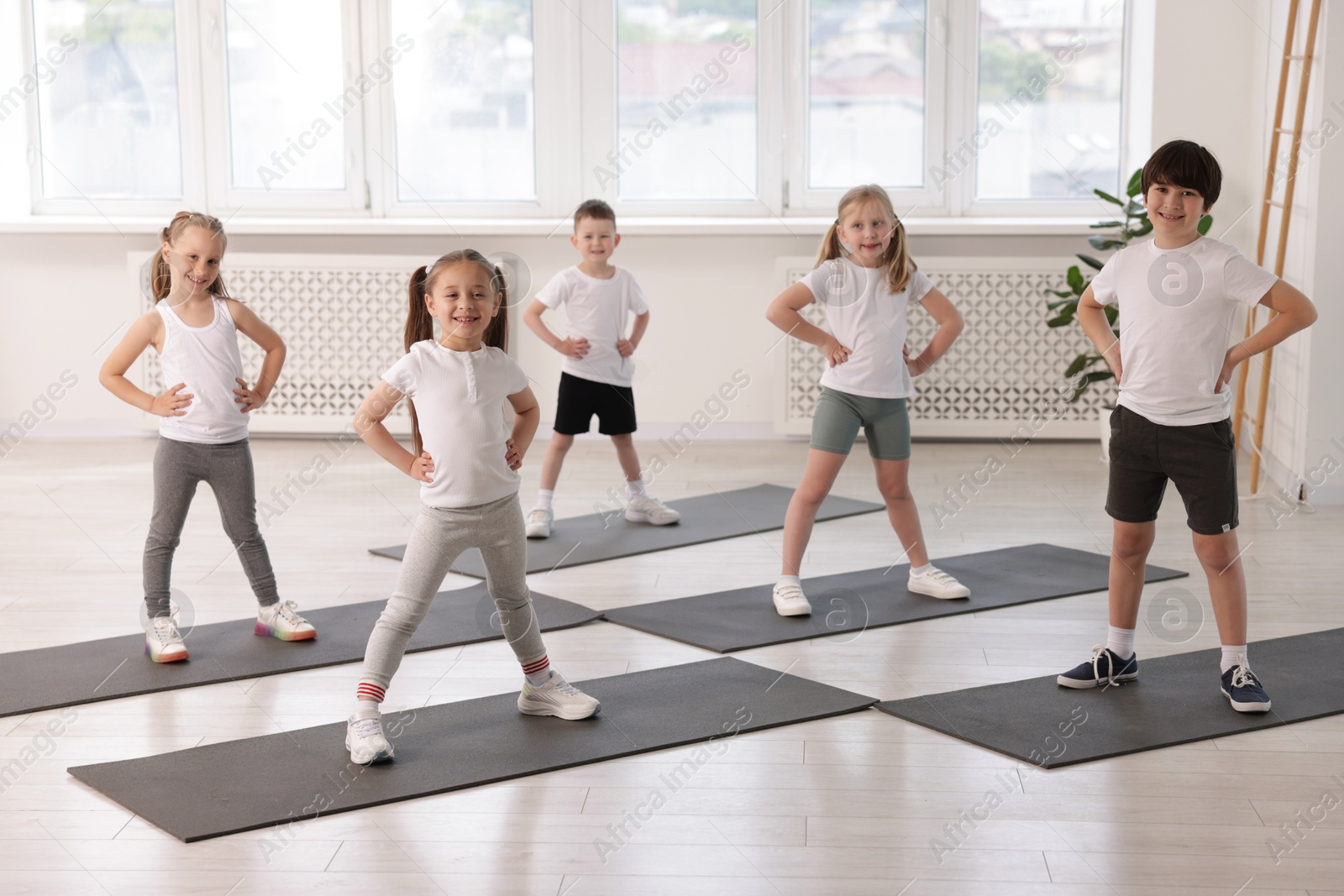 Photo of Group of children on yoga mats in class