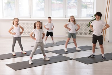 Photo of Group of children on yoga mats in class