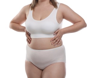 Photo of Weight loss. Plus size woman in underwear on white background, closeup