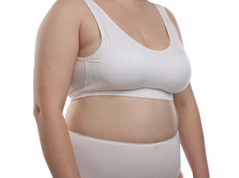 Photo of Weight loss. Plus size woman in underwear on white background, closeup