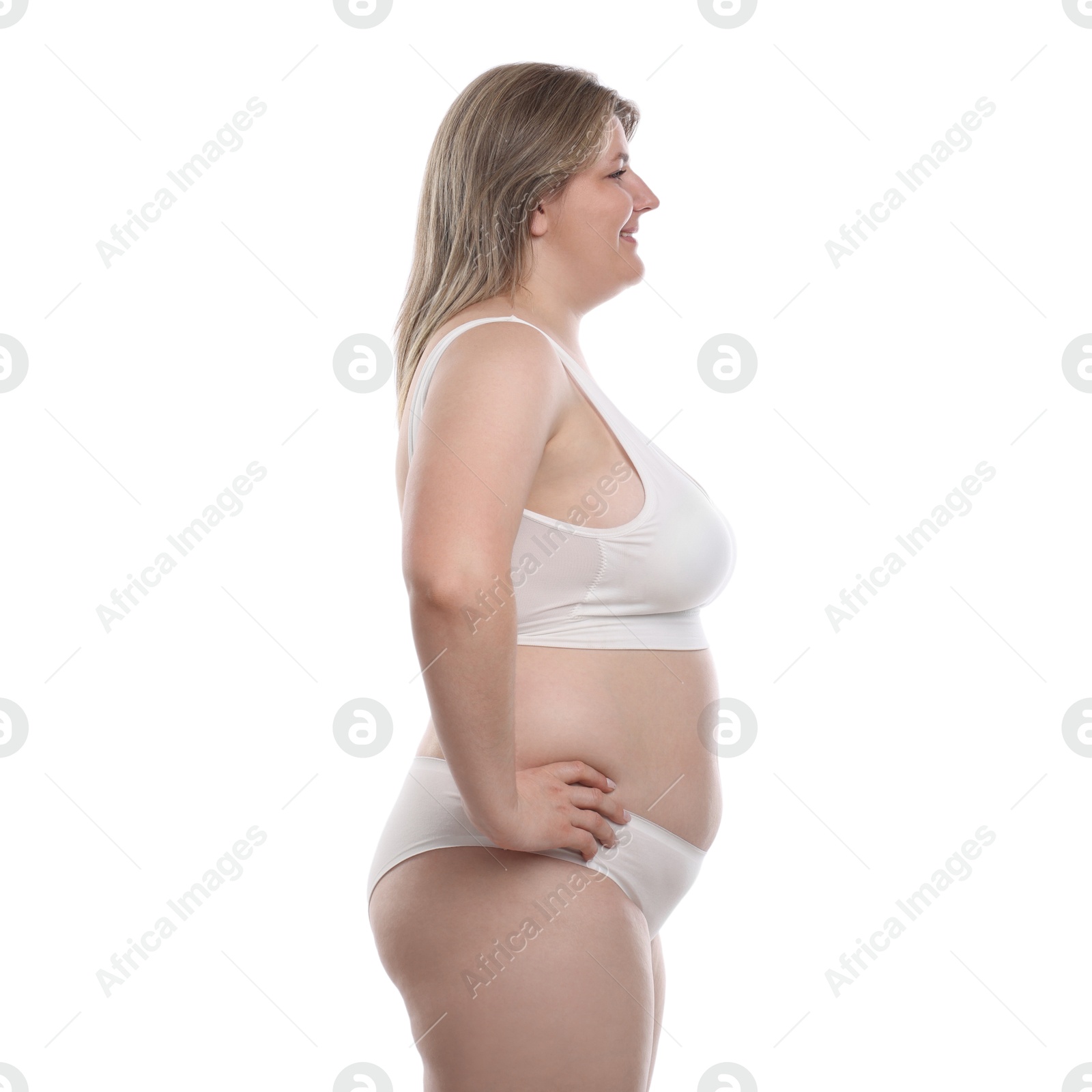 Weight loss. Plus size woman in underwear on white background Photo of Weight loss. Plus size woman in underwear on white background