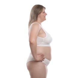 Photo of Weight loss. Plus size woman in underwear on white background