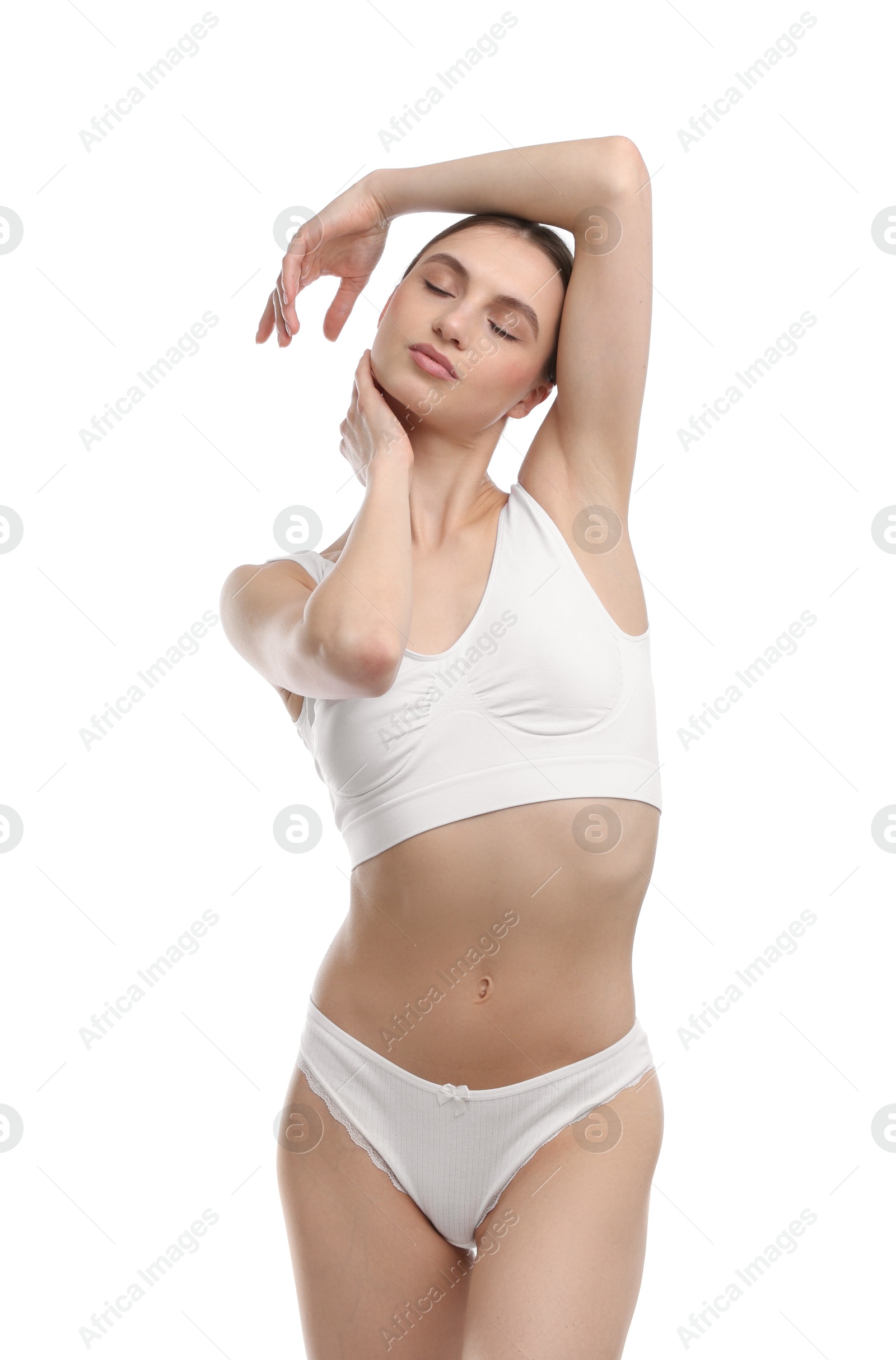 Woman wearing beautiful underwear on white background Photo of Woman wearing beautiful underwear on white background
