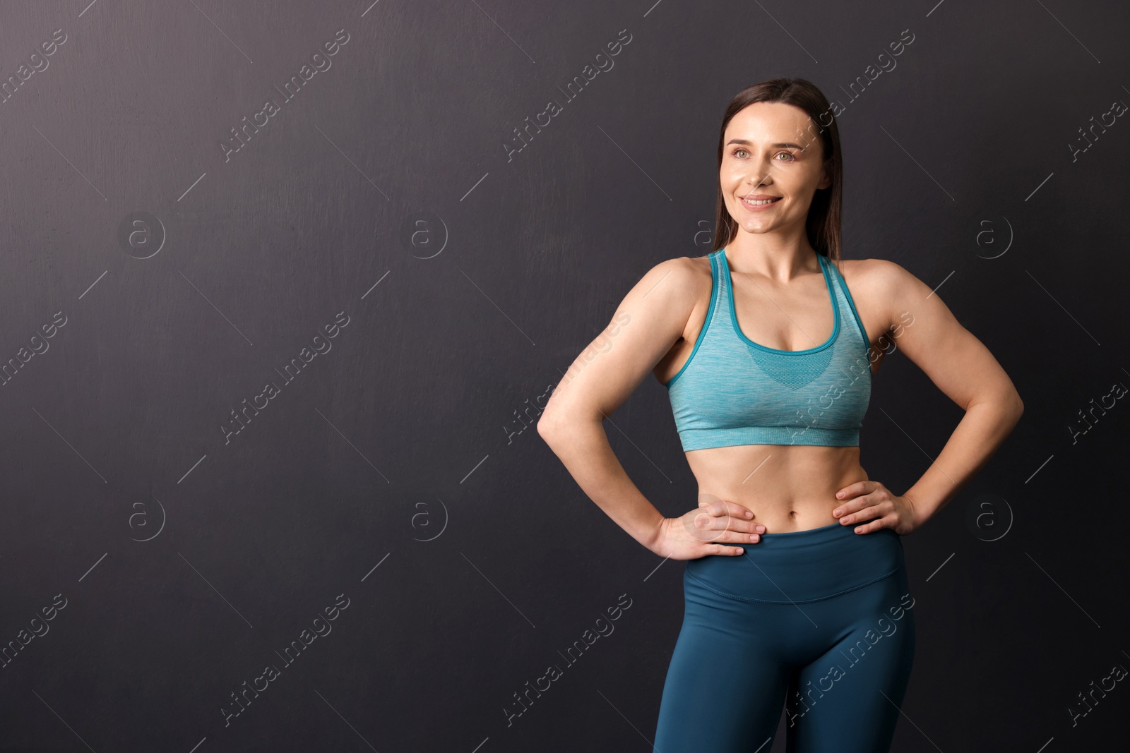 Portrait of professional trainer on black background. Space for text Photo of Portrait of professional trainer on black background. Space for text