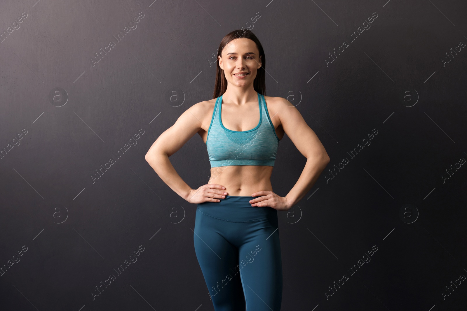 Portrait of professional trainer on black background Photo of Portrait of professional trainer on black background