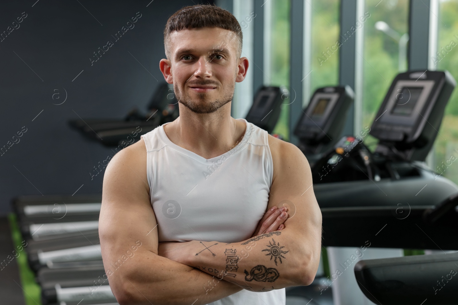 Portrait of professional personal trainer in sport center Photo of Portrait of professional personal trainer in sport center