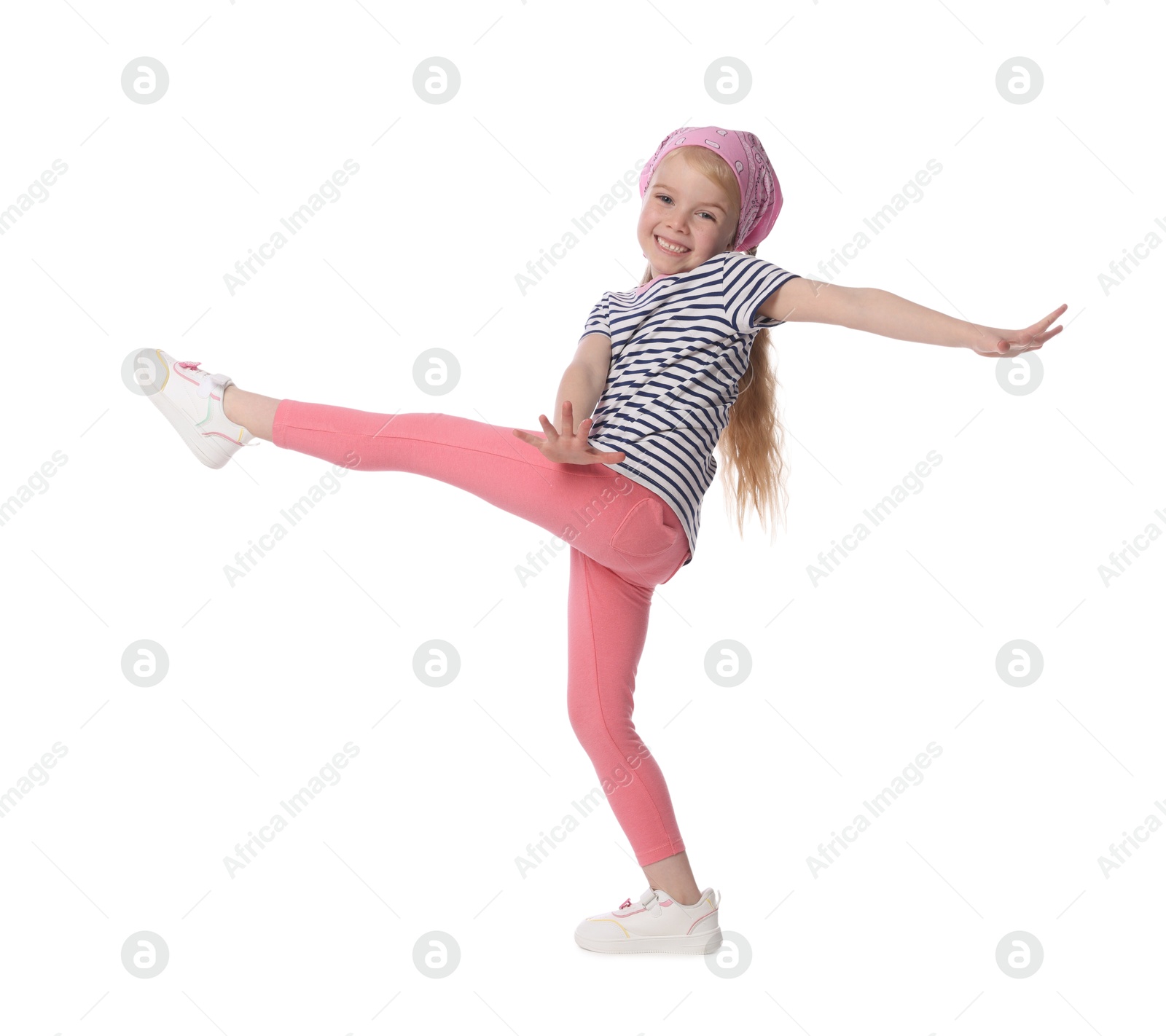 Cute little girl dancing on white background Photo of Cute little girl dancing on white background