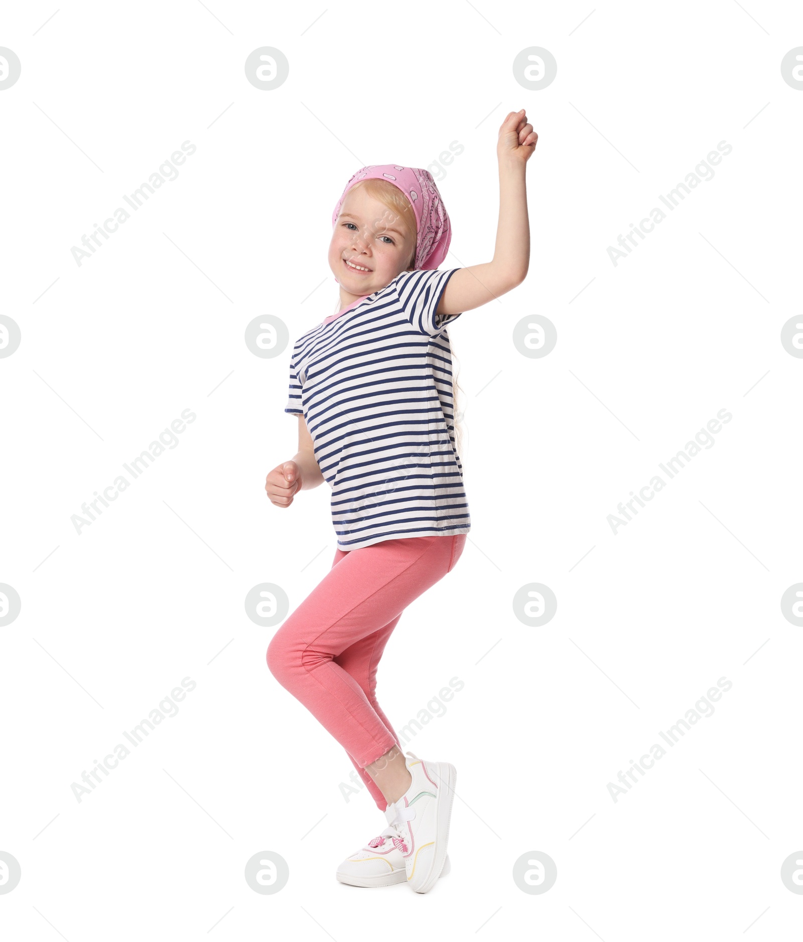 Cute little girl dancing on white background Photo of Cute little girl dancing on white background