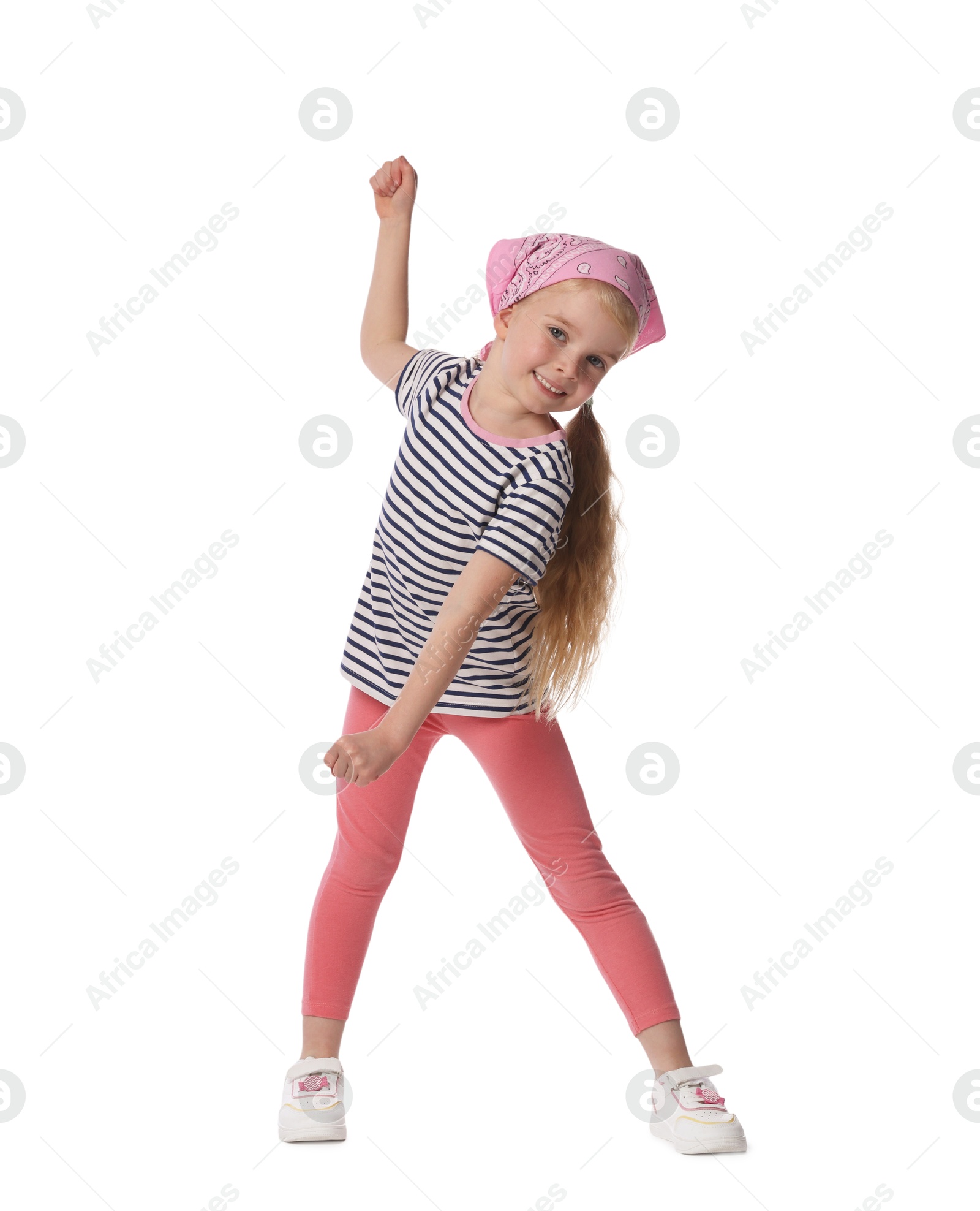 Cute little girl dancing on white background Photo of Cute little girl dancing on white background