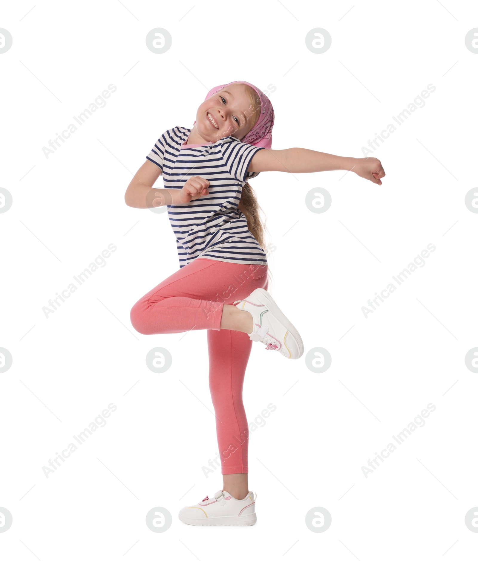 Cute little girl dancing on white background Photo of Cute little girl dancing on white background