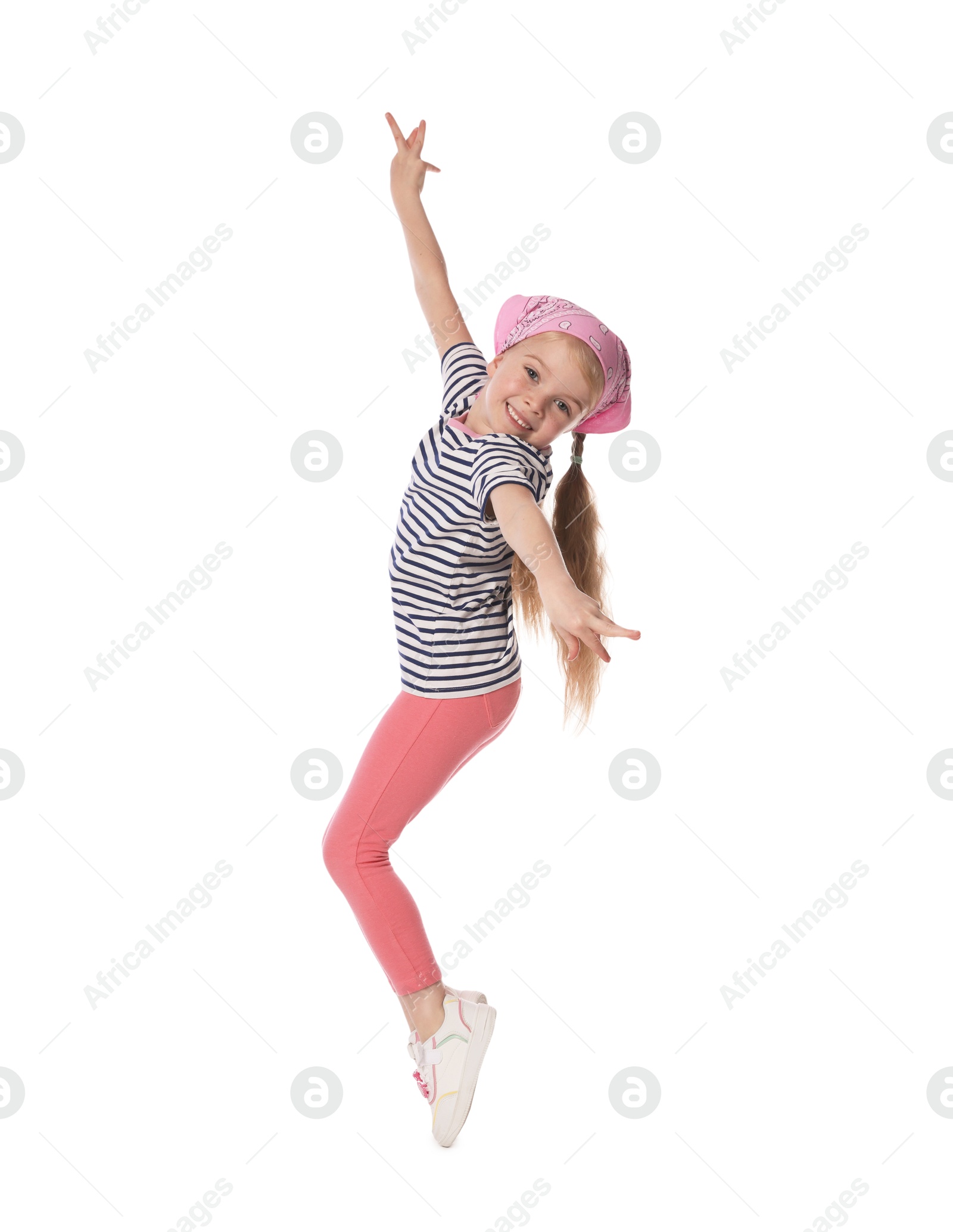 Cute little girl dancing on white background Photo of Cute little girl dancing on white background