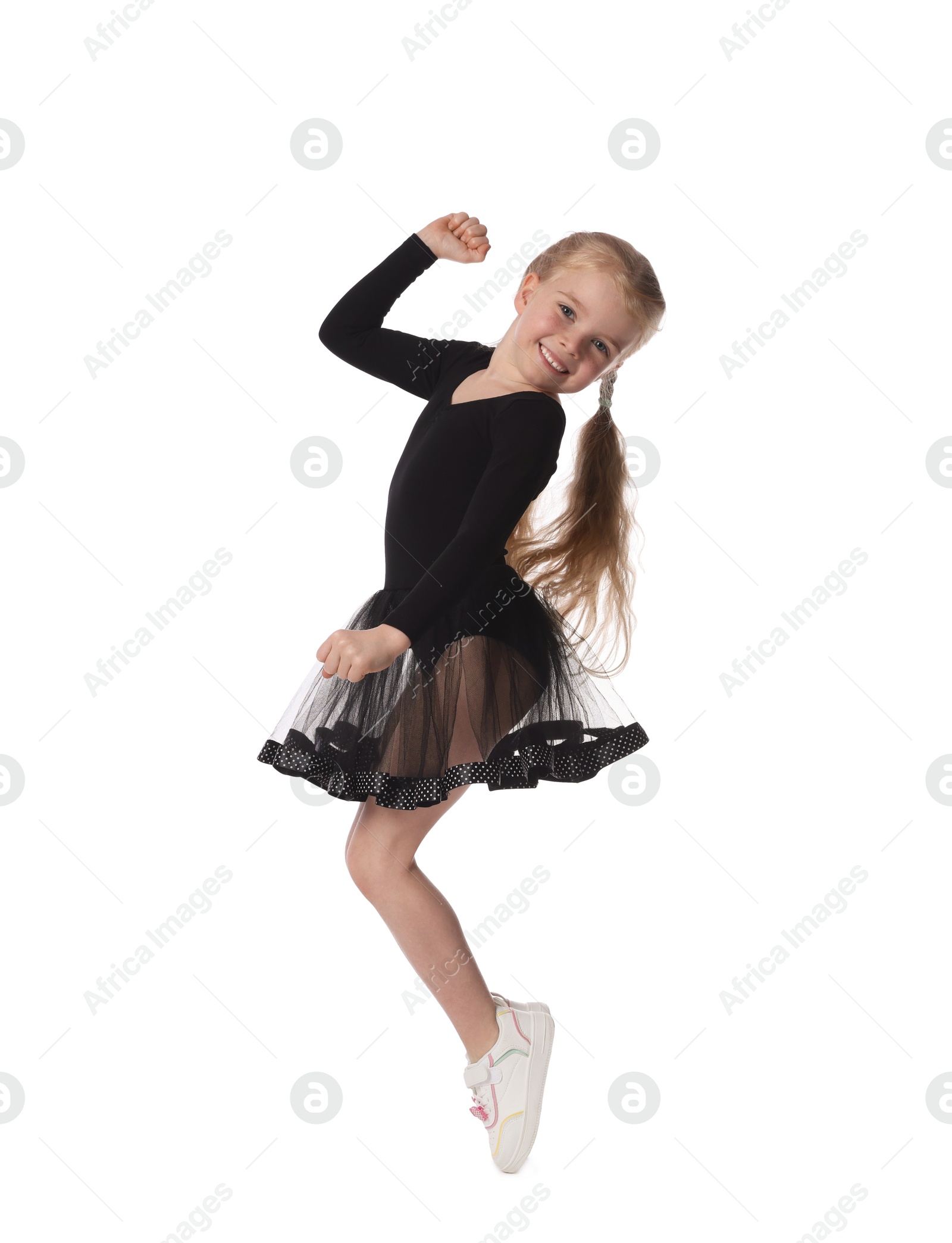 Cute little girl dancing on white background Photo of Cute little girl dancing on white background