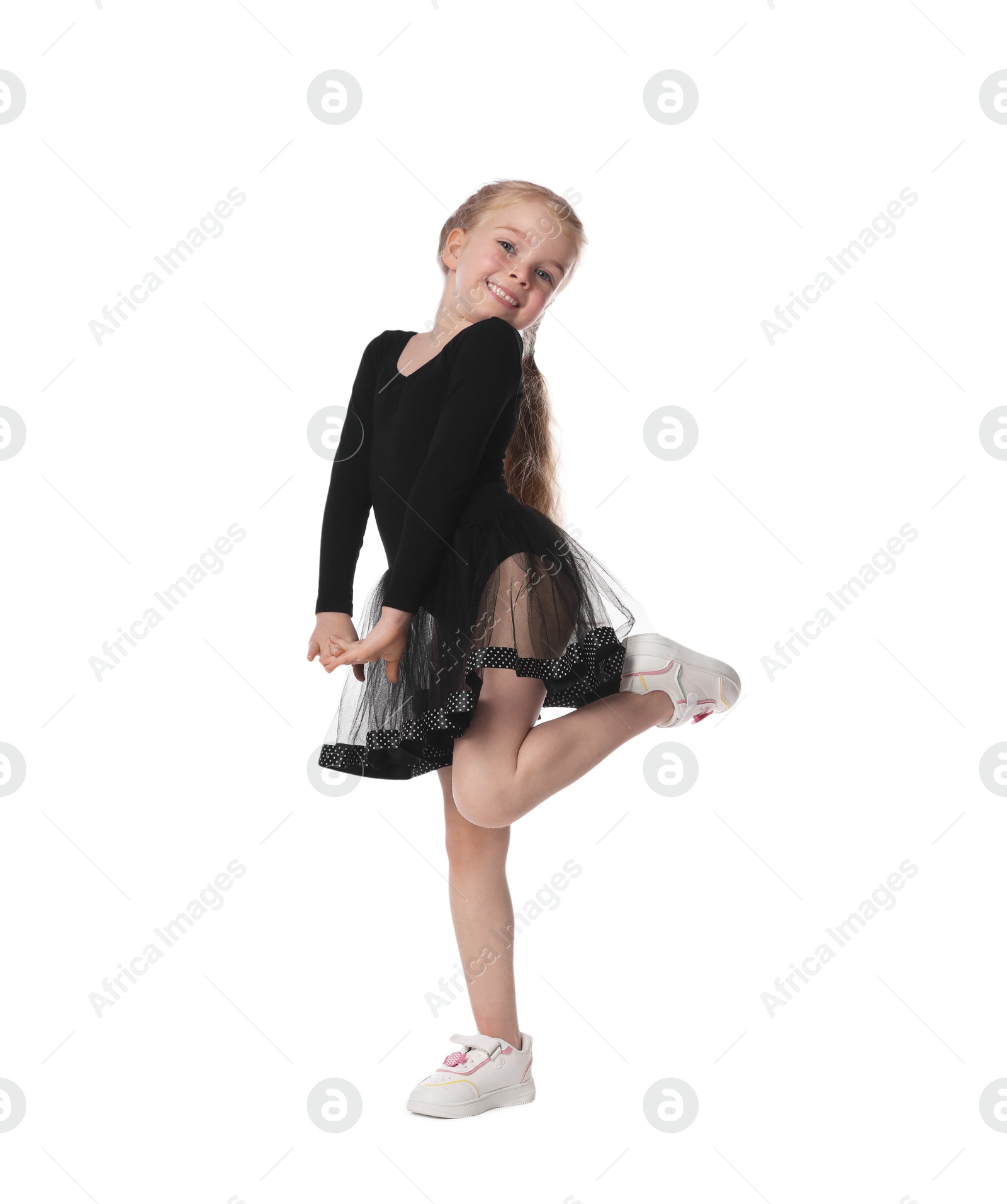 Cute little girl dancing on white background Photo of Cute little girl dancing on white background