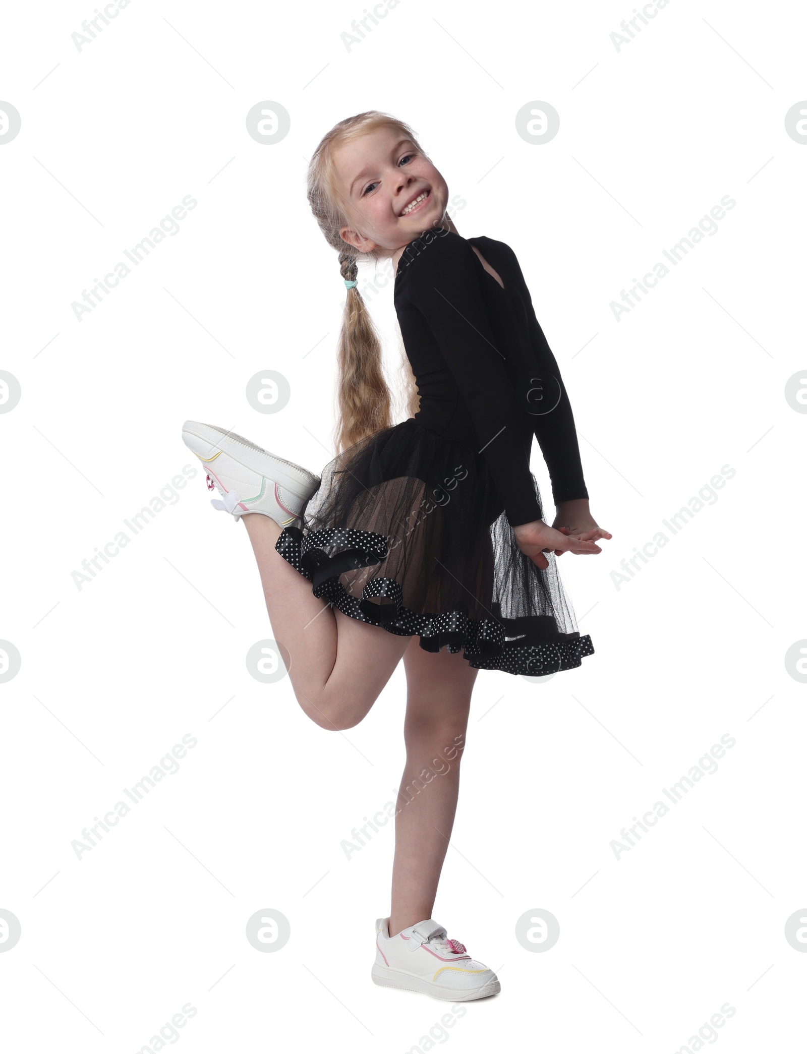 Cute little girl dancing on white background Photo of Cute little girl dancing on white background