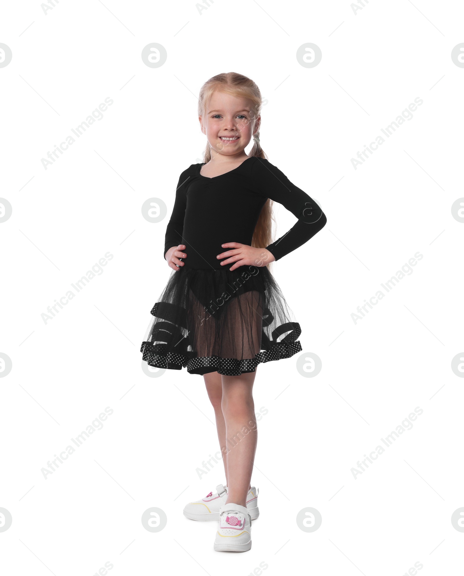 Cute little girl dancing on white background Photo of Cute little girl dancing on white background