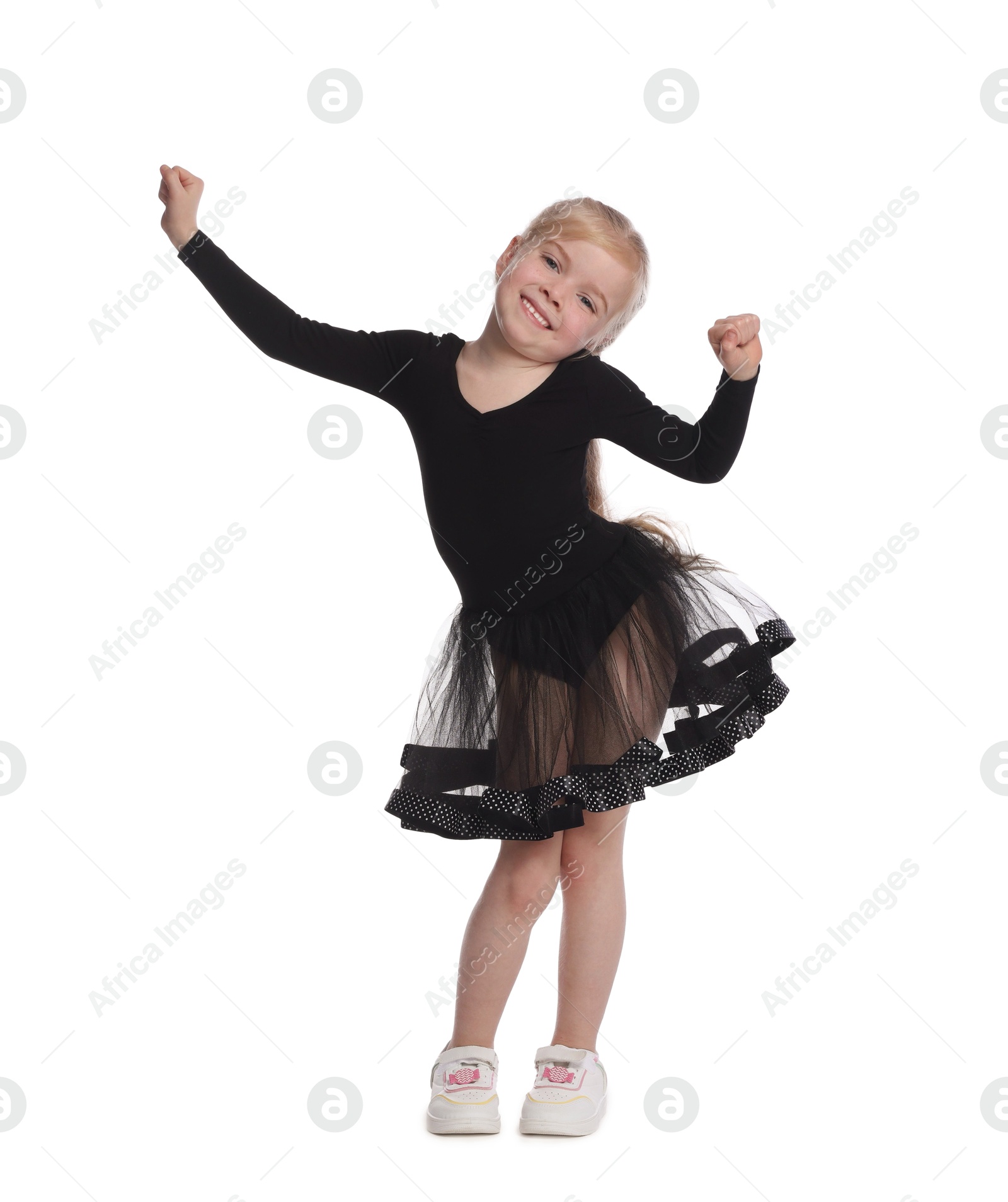Cute little girl dancing on white background Photo of Cute little girl dancing on white background