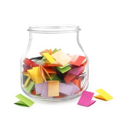 Photo of Colorful paper pieces in glass jar isolated on white
