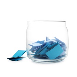 Photo of Colorful paper pieces in glass jar isolated on white
