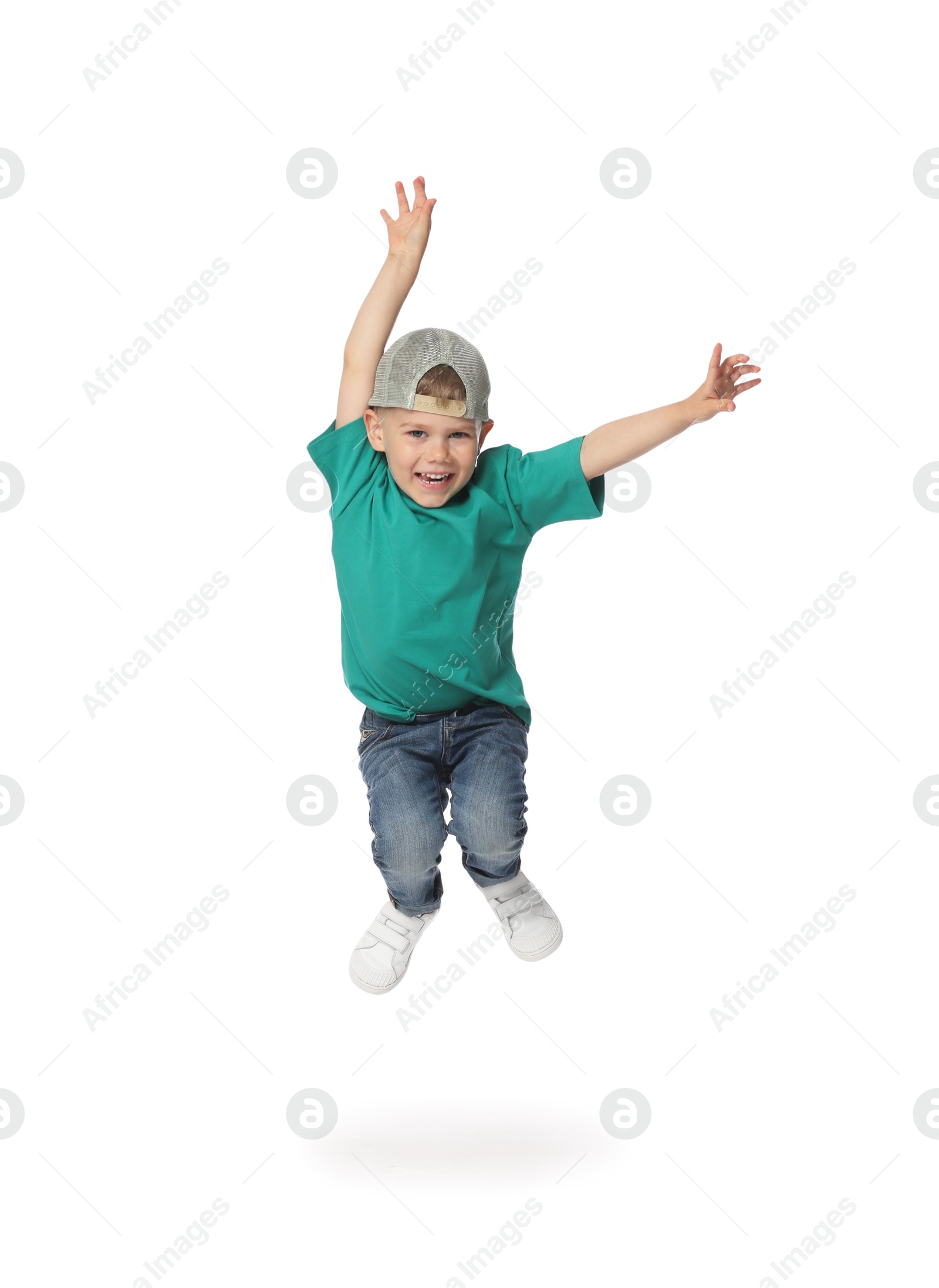 Happy little boy dancing on white background Photo of Happy little boy dancing on white background