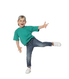 Photo of Happy little boy dancing on white background