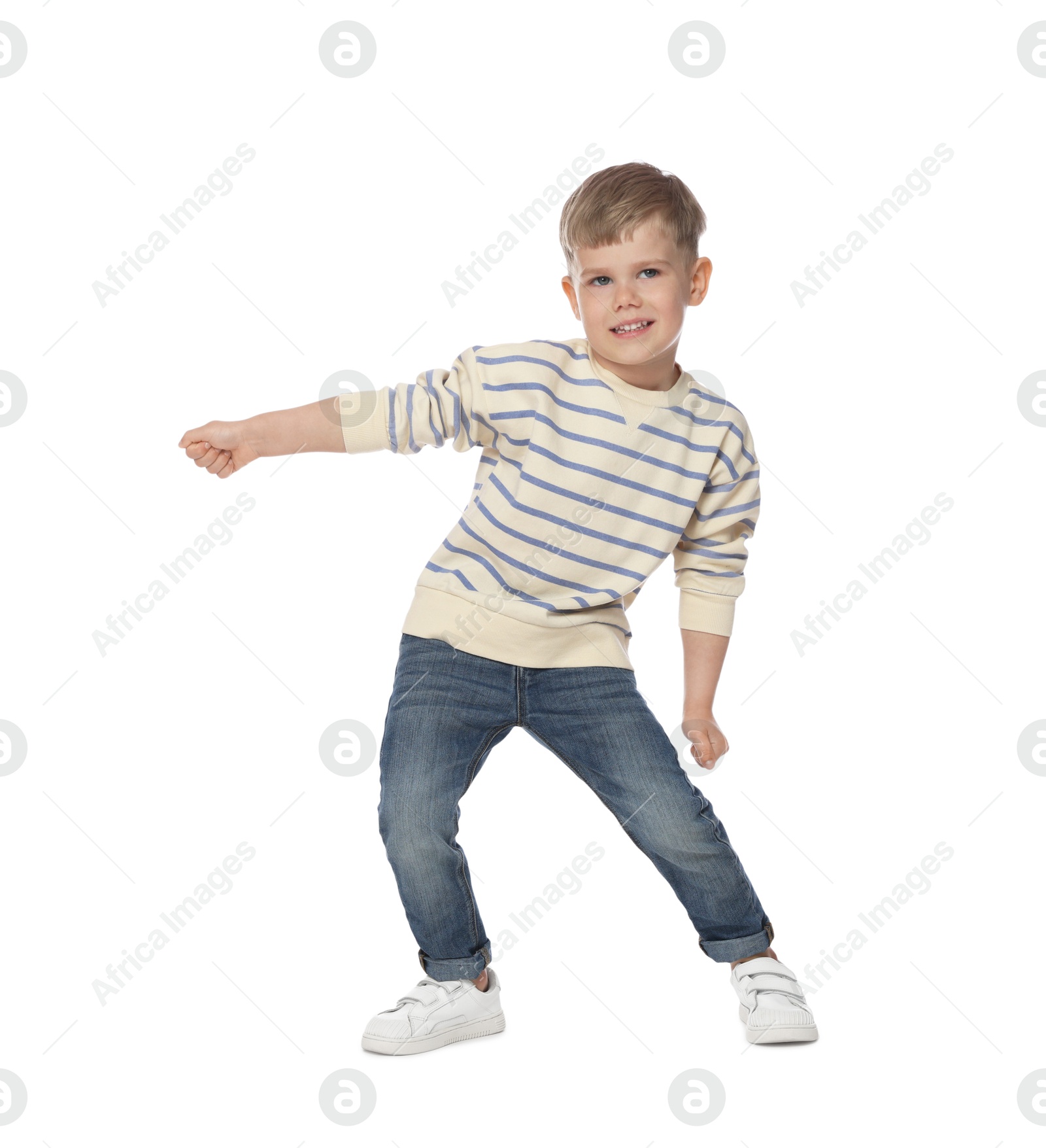 Happy little boy dancing on white background Photo of Happy little boy dancing on white background