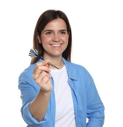 Photo of Targeting. Smiling woman with dart on white background
