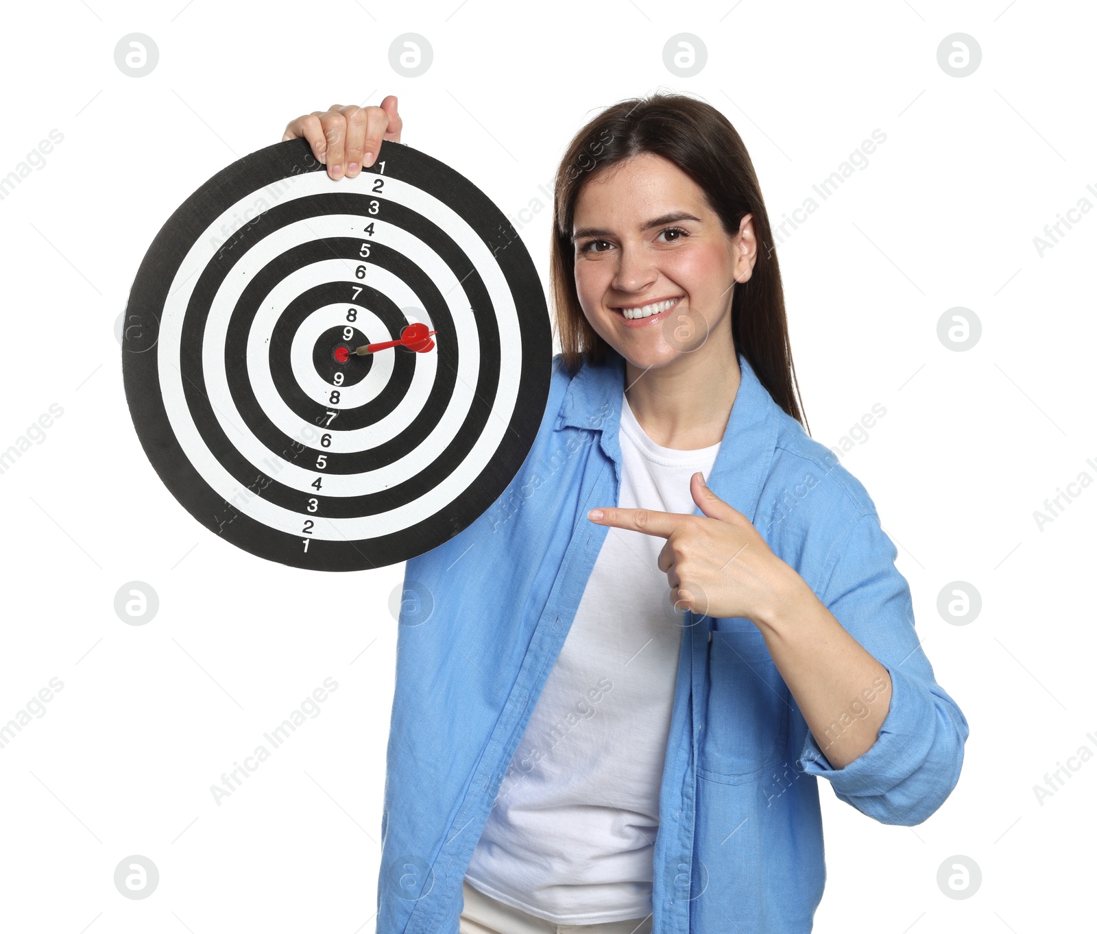 Targeting. Smiling woman pointing at dart board with arrow on white background Photo of Targeting. Smiling woman pointing at dart board with arrow on white background