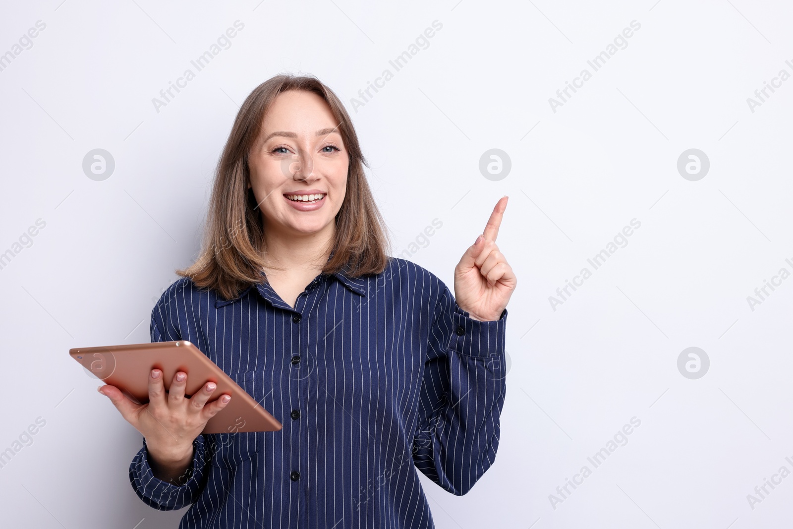 Woman with modern tablet on white background, space for text Photo of Woman with modern tablet on white background, space for text