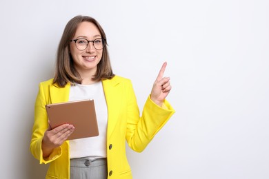 Photo of Woman with modern tablet on white background, space for text