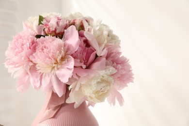Photo of Bouquet of beautiful peonies on white background, closeup. Space for text