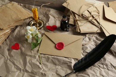 Photo of Composition with love letters and flowers on table