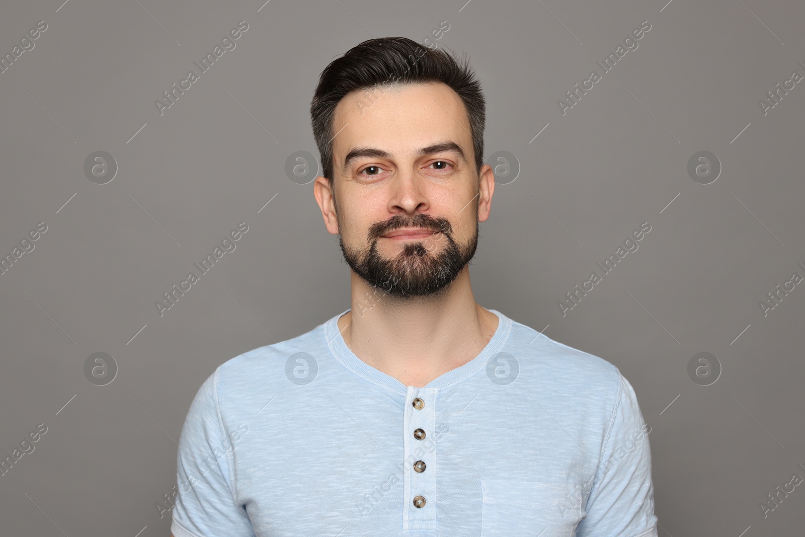 Handsome man before shaving on grey background Photo of Handsome man before shaving on grey background