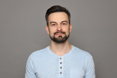 Photo of Handsome man before shaving on grey background