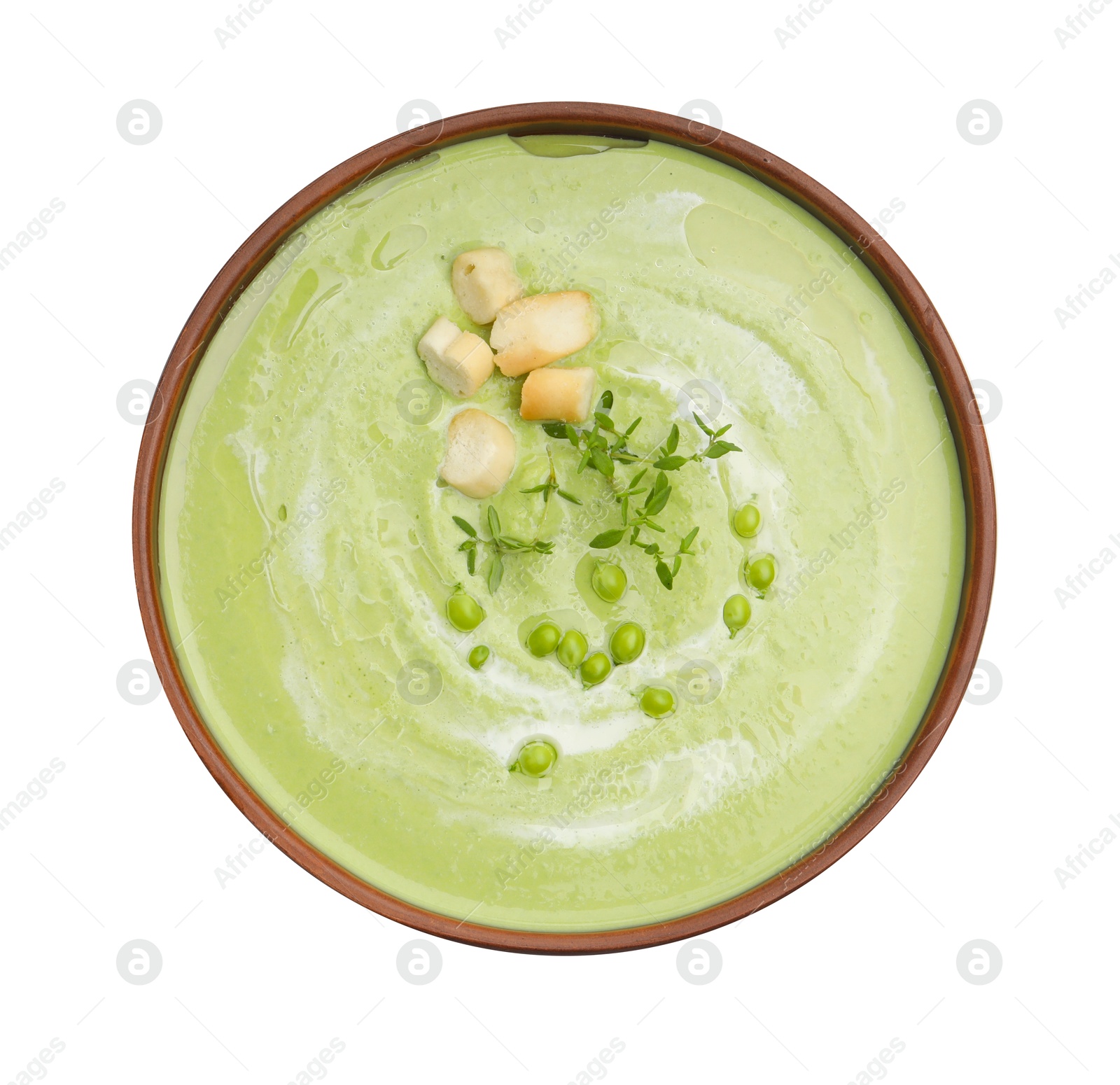 Tasty pea cream soup with croutons and thyme isolated on white, top view Photo of Tasty pea cream soup with croutons and thyme isolated on white, top view