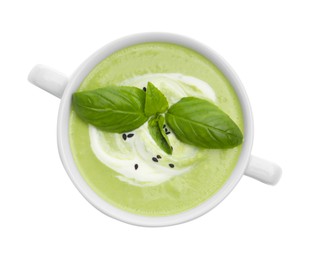 Photo of Tasty pea cream soup with basil isolated on white, top view