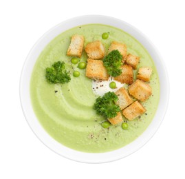 Photo of Tasty pea cream soup with croutons and broccoli isolated on white, top view