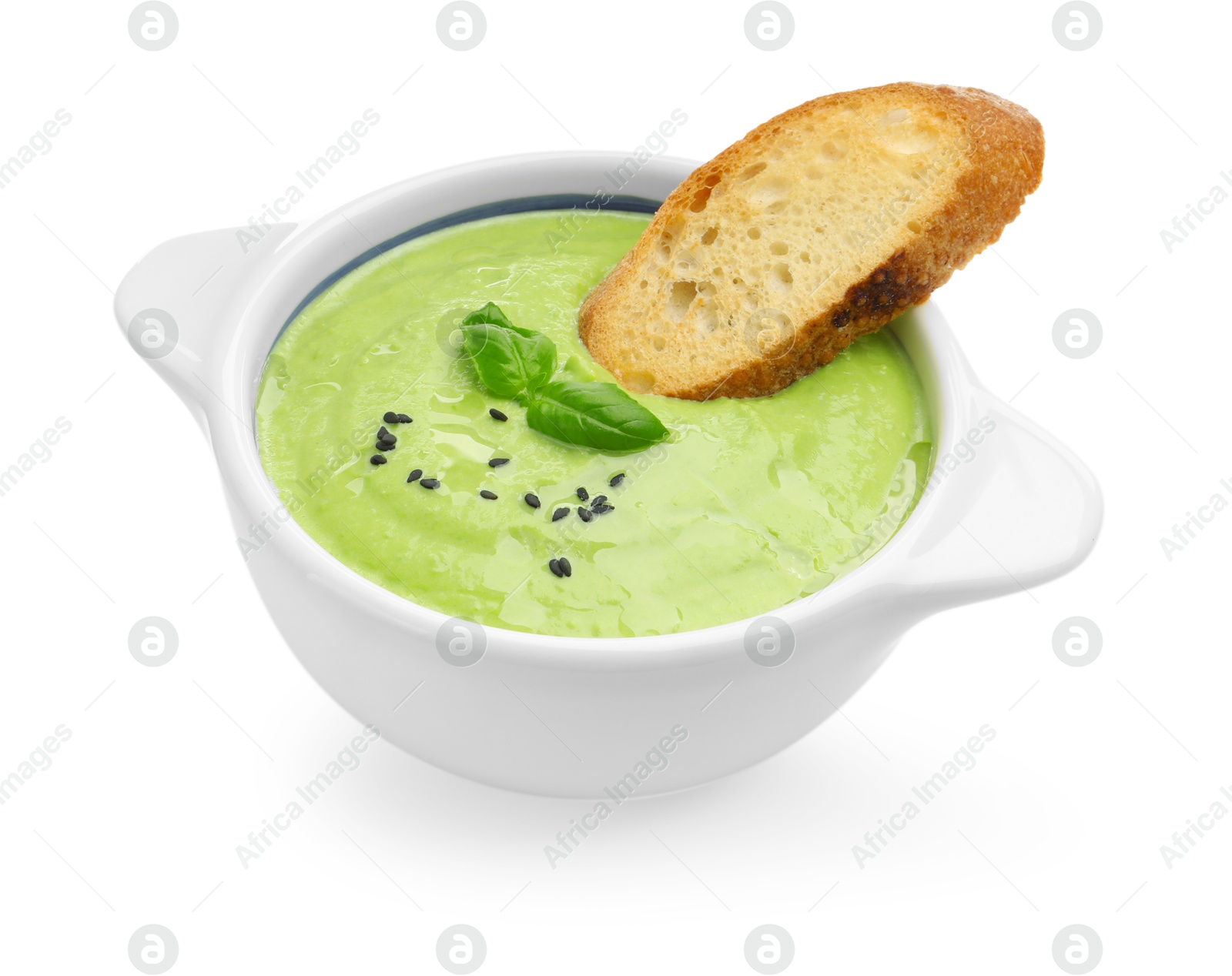 Photo of Tasty pea cream soup with basil and crouton isolated on white