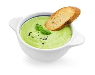 Photo of Tasty pea cream soup with basil and crouton isolated on white