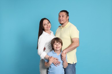 Photo of Portrait of happy family on light blue background