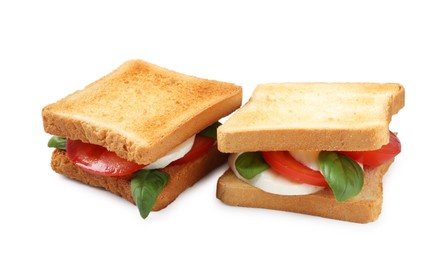 Photo of Tasty sandwiches with mozzarella cheese, tomatoes and basil on white background