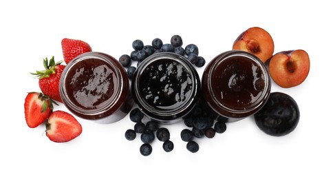 Photo of Different sweet jams in jars and ingredients isolated on white, top view