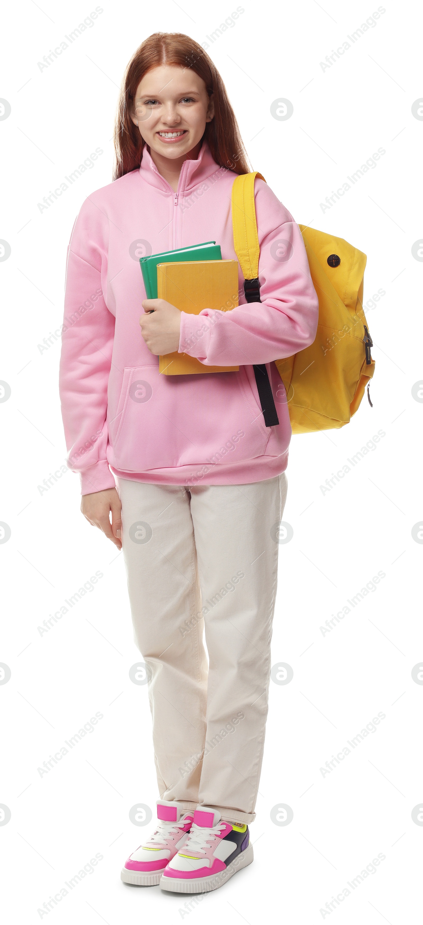 Teenage girl with books and backpack on white background Photo of Teenage girl with books and backpack on white background