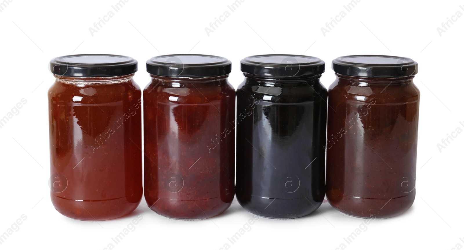 Different sweet jams in jars isolated on white Photo of Different sweet jams in jars isolated on white