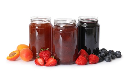 Photo of Different jams in jars and ingredients isolated on white