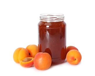 Photo of Sweet jam in jar and apricots isolated on white