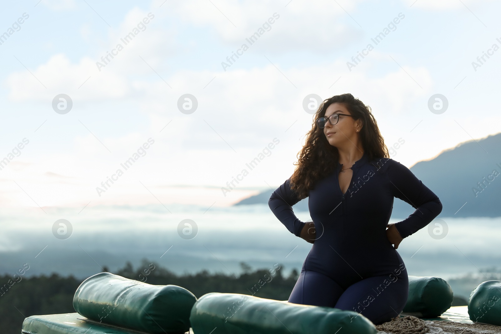 Beautiful woman enjoying picturesque view of mountains. Space for text Photo of Beautiful woman enjoying picturesque view of mountains. Space for text