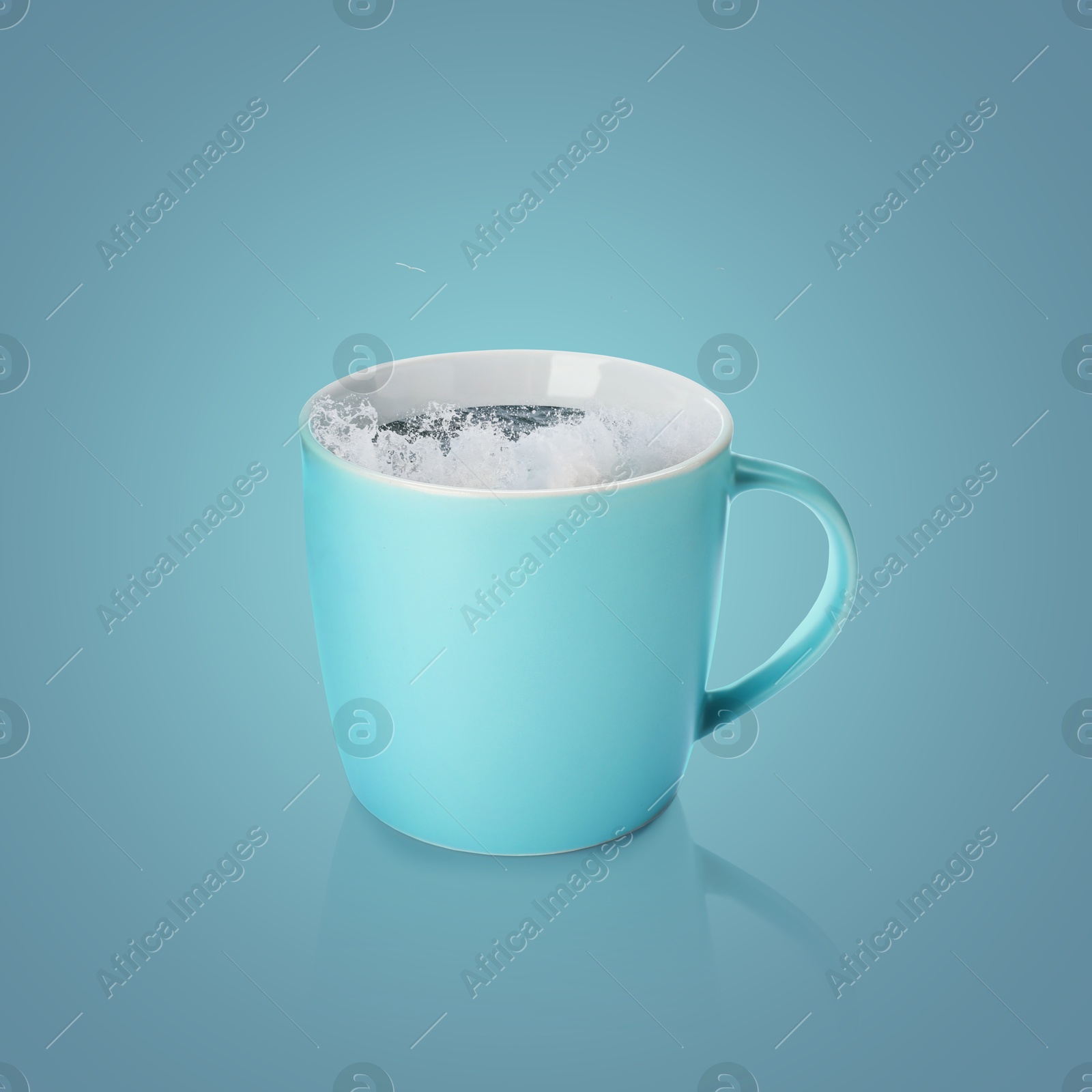 Sea wave splashing out of ceramic cup on pastel blue background Image of Sea wave splashing out of ceramic cup on pastel blue background