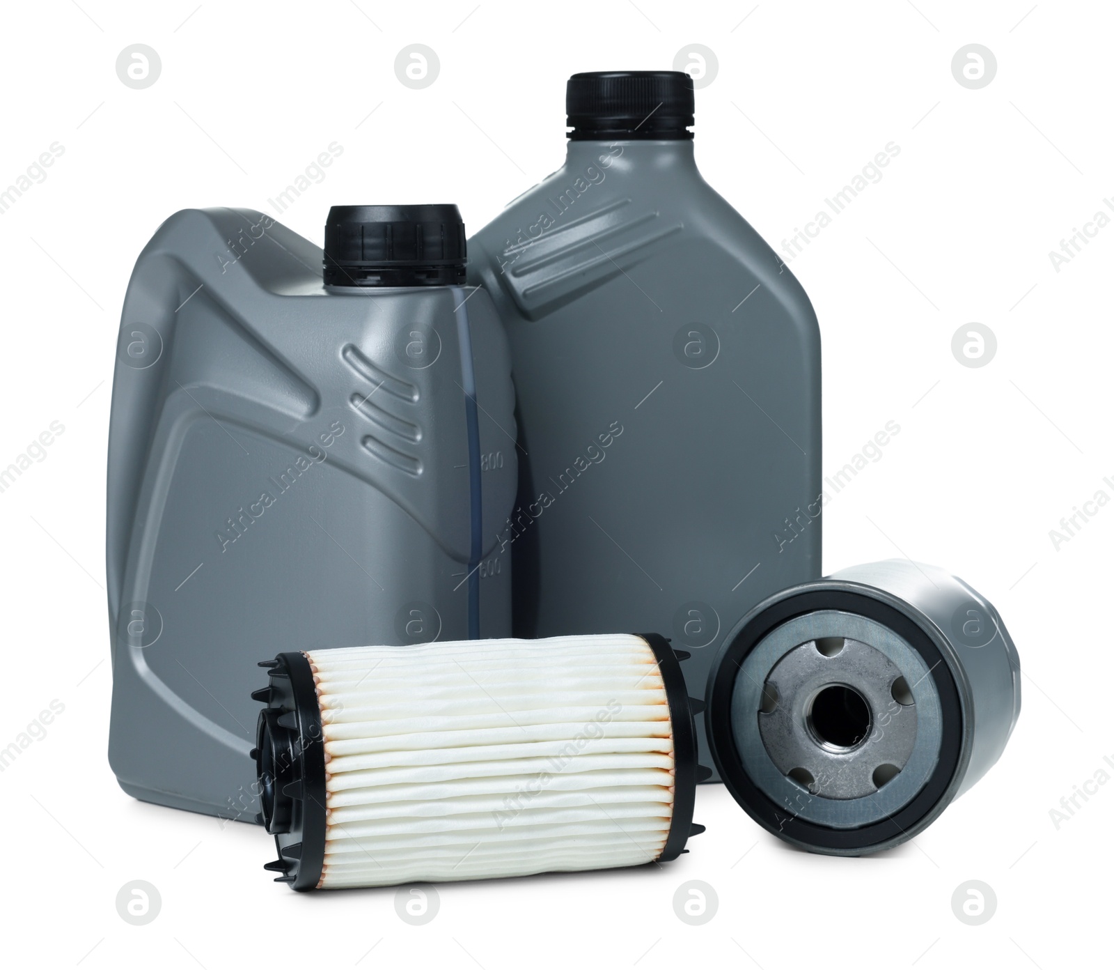 Photo of Motor oil in plastic canisters and filters isolated on white