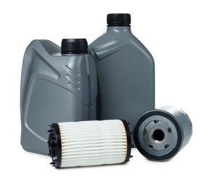 Photo of Motor oil in plastic canisters and filters isolated on white